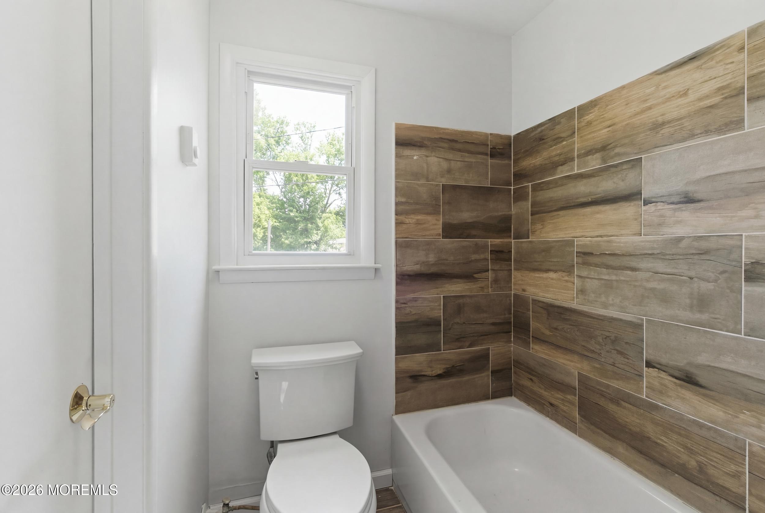 93 Baser Lane Brick, NJ 08724 - Photo 10 of 21 a bathroom with a toilet and shower