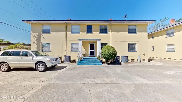 a view of a car parked in front of a house