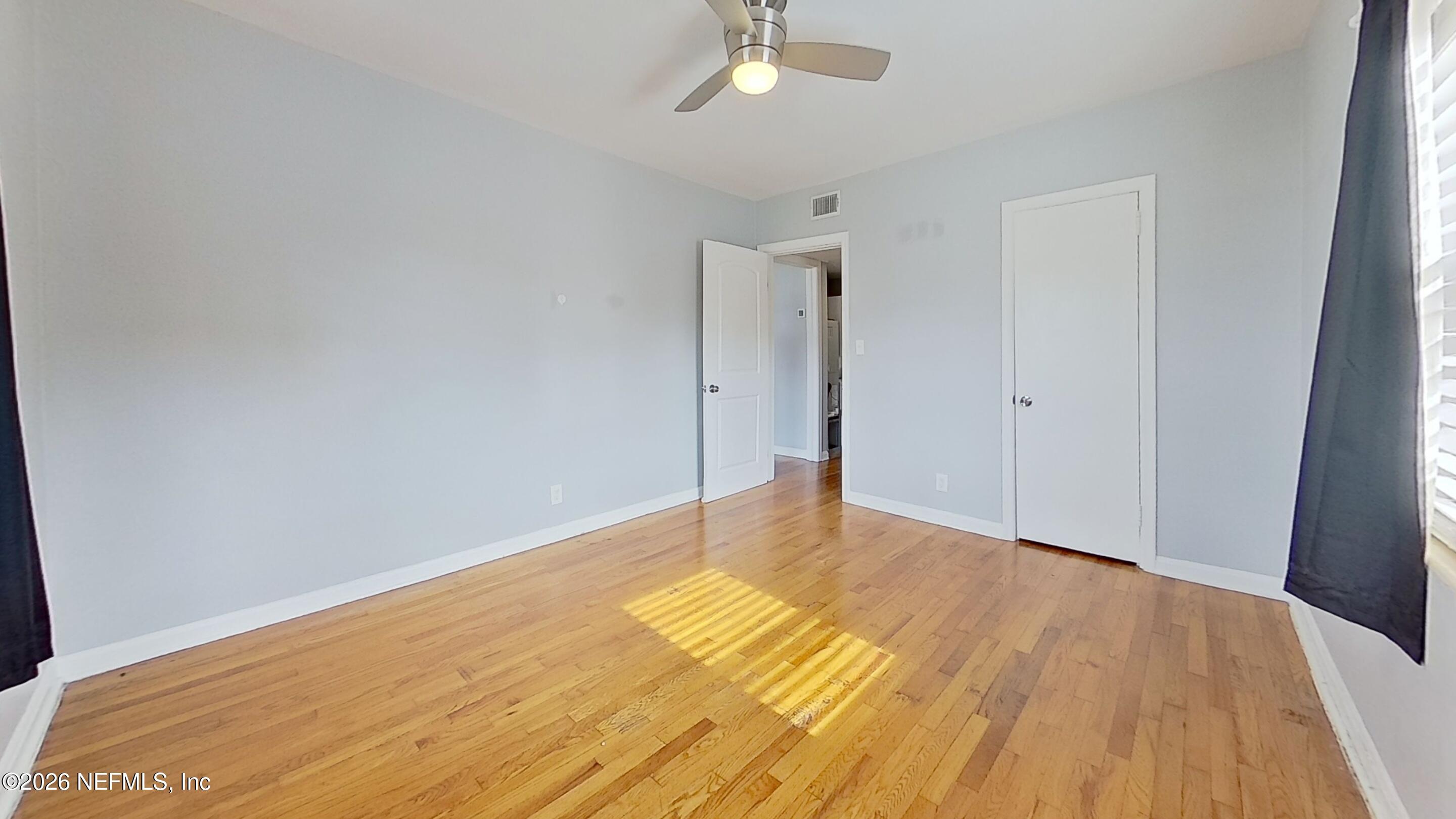 1551 Nicholson Road, Unit 2 Jacksonville, FL 32207 - Photo 8 of 19 a view of an empty room with wooden floor