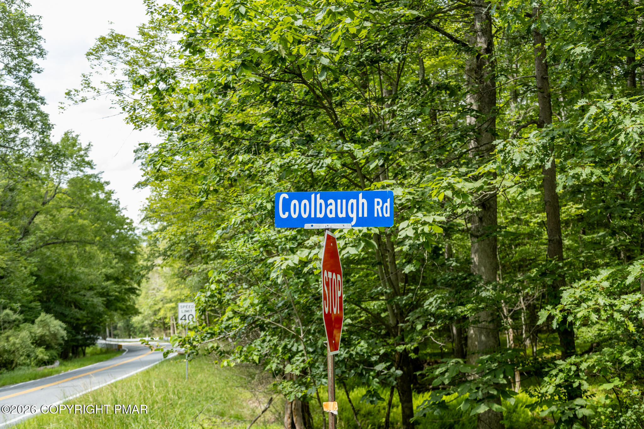 0 Coolbaugh Road East Stroudsburg, PA 18302 - Photo 13 of 18 a sign that is sitting in the tall tree