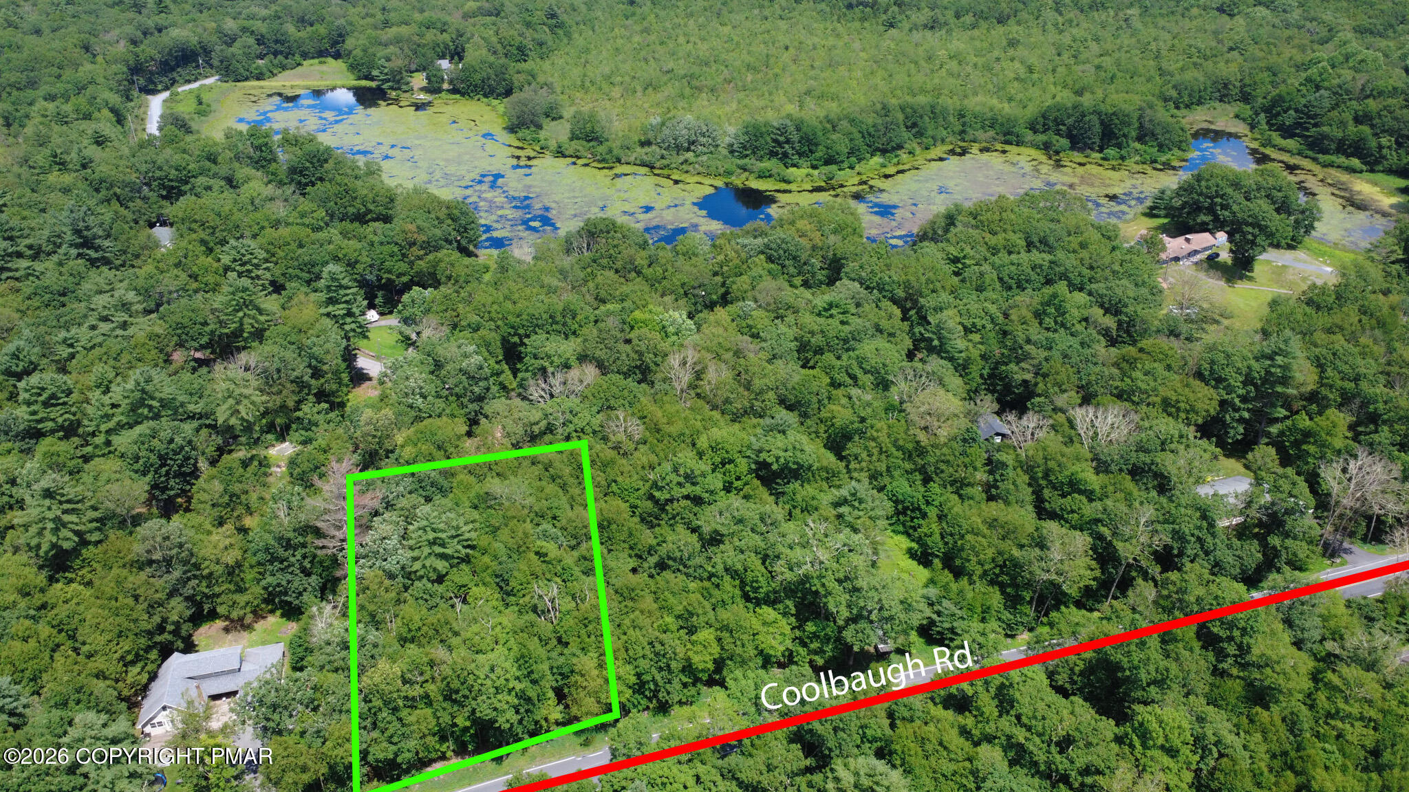 0 Coolbaugh Road East Stroudsburg, PA 18302 - Photo 3 of 18 an aerial view of a house with a yard and lake view