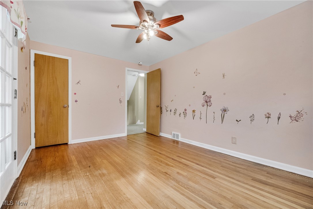 4430 Silsby Road Cleveland, OH 44118 - Photo 28 of 43 Unfurnished room featuring ceiling fan and light hardwood / wood-style flooring