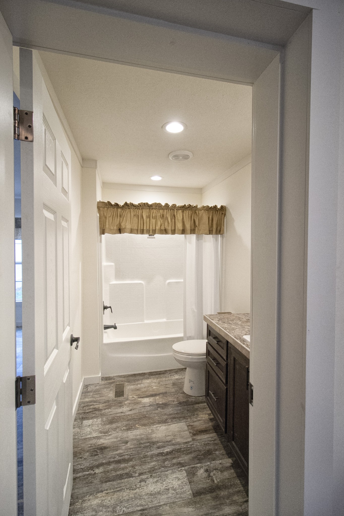 2555 Liverpool Road Woodlawn, TN 37191 - Photo 13 of 21 a bathroom with a sink toilet and shower