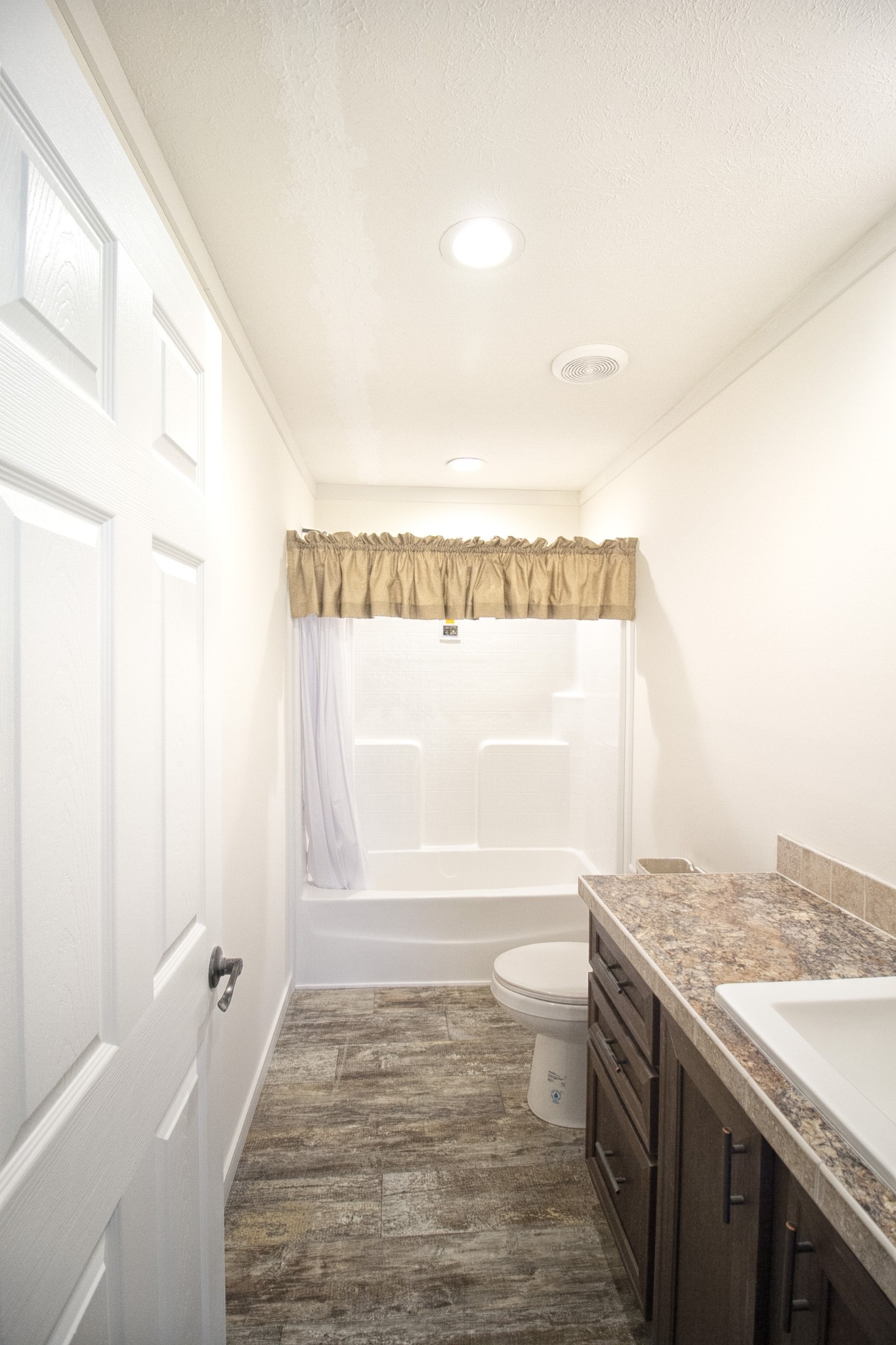 2555 Liverpool Road Woodlawn, TN 37191 - Photo 14 of 21 a bathroom with a granite countertop sink and a large mirror