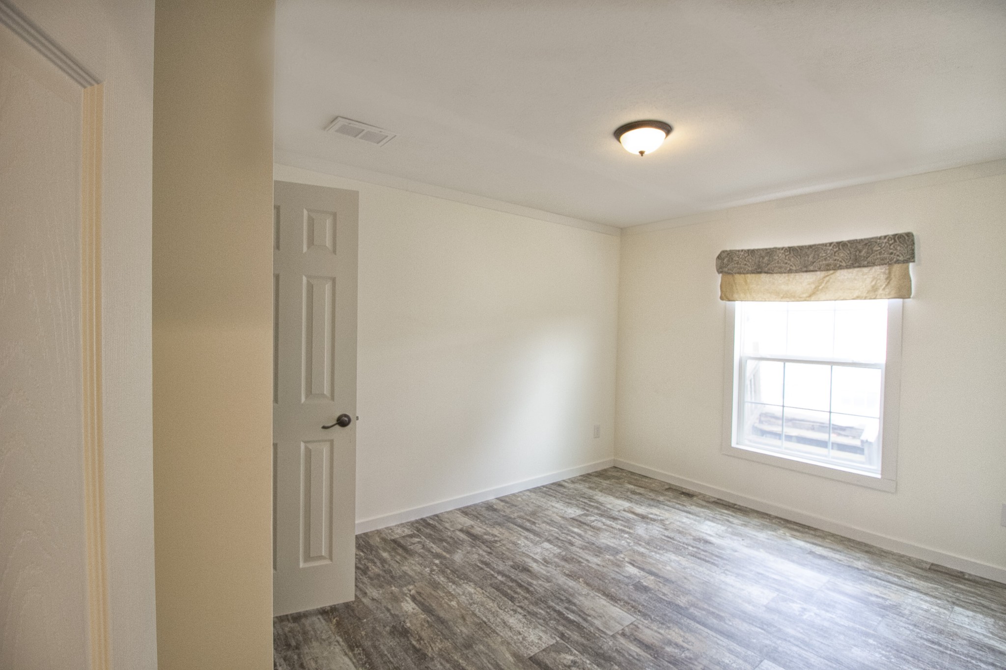 2555 Liverpool Road Woodlawn, TN 37191 - Photo 17 of 21 a view of empty room with wooden floor