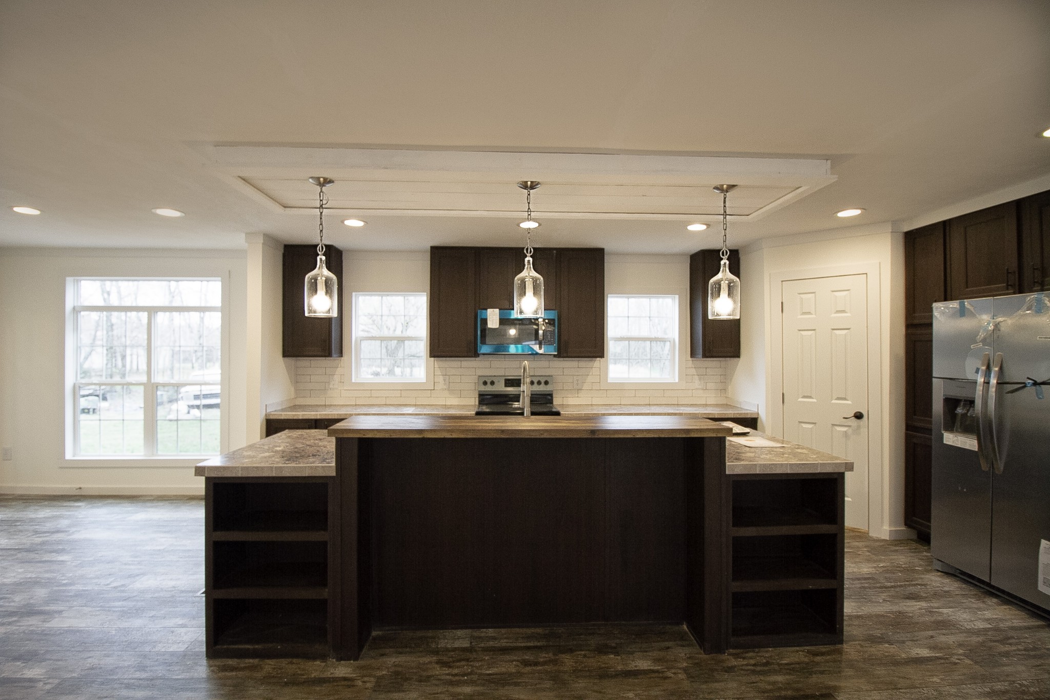 2555 Liverpool Road Woodlawn, TN 37191 - Photo 2 of 21 a kitchen with granite countertop a sink cabinets and stainless steel appliances