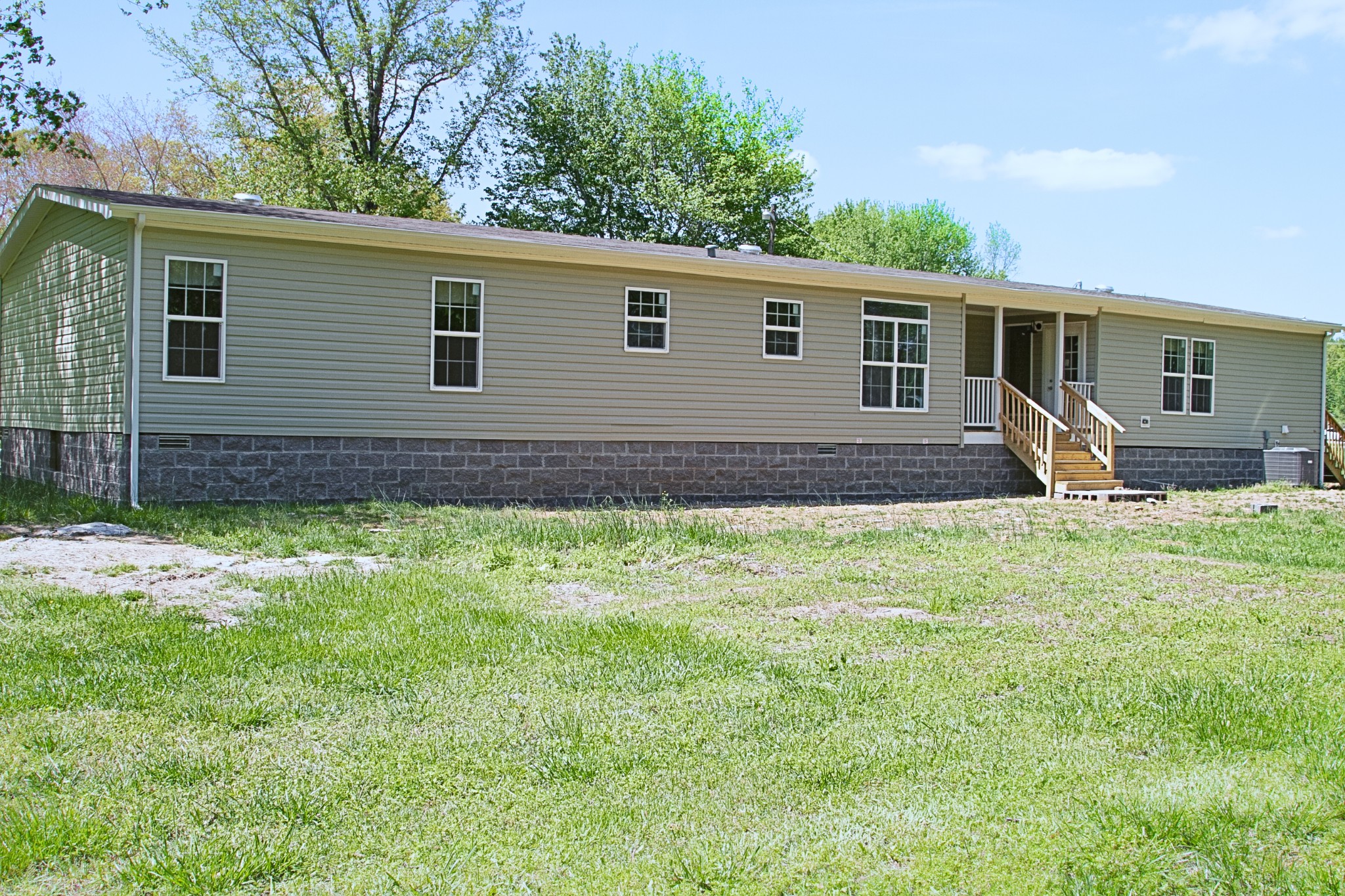2555 Liverpool Road Woodlawn, TN 37191 - Photo 21 of 21 a view of a backyard with plants and large tree