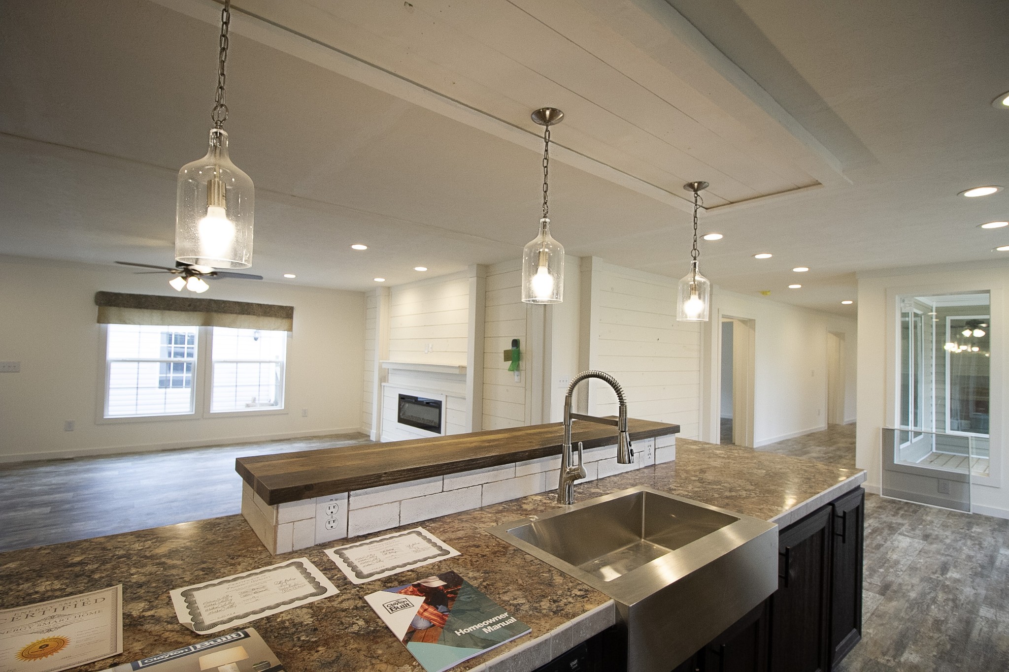 2555 Liverpool Road Woodlawn, TN 37191 - Photo 5 of 21 a large kitchen with a stove a sink a counter space and a center island