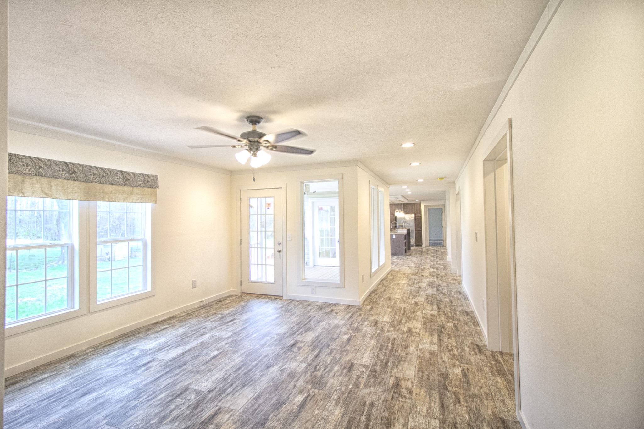 2555 Liverpool Road Woodlawn, TN 37191 - Photo 8 of 21 wooden floor in an empty room with a window
