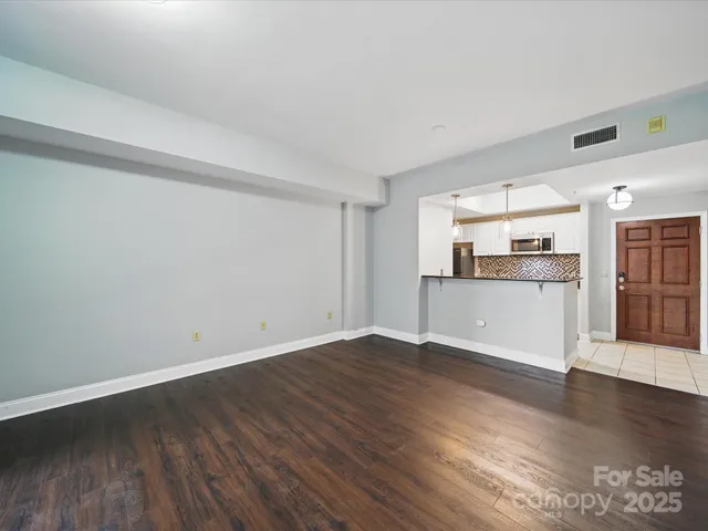 a view of kitchen with wooden floor