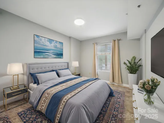 a bedroom with bed and a potted plant