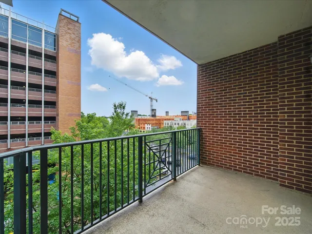 a view of balcony with a potted plant