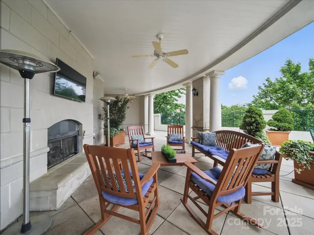 a view of a livingroom with furniture and a fireplace