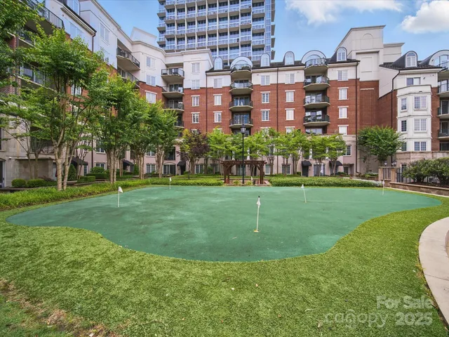 a view of a building with a yard