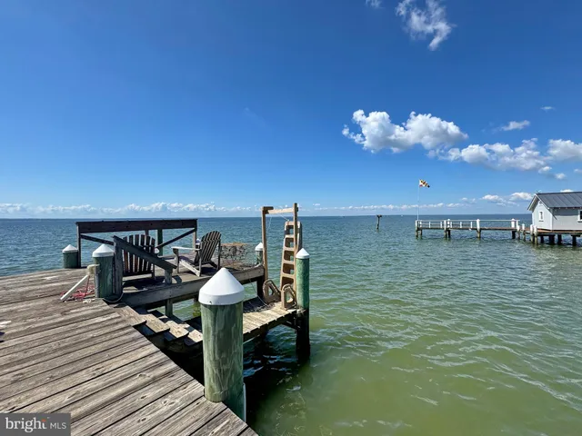 a stove top oven sitting inside of a kitchen