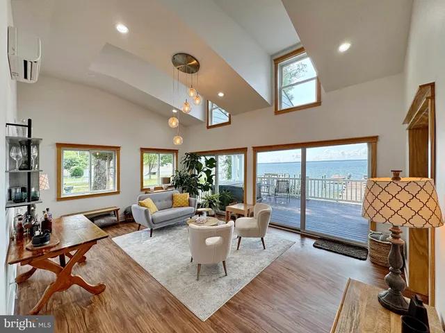 a kitchen with a refrigerator stove and white cabinets