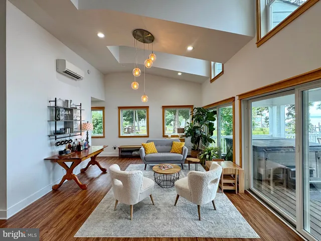 a bathroom with a bathtub a window and a shower
