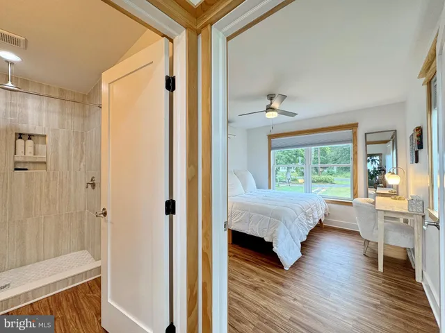 a view of a chairs and table on the wooden floor