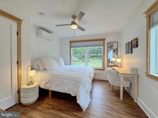 a view of a room with a furniture and wooden floor