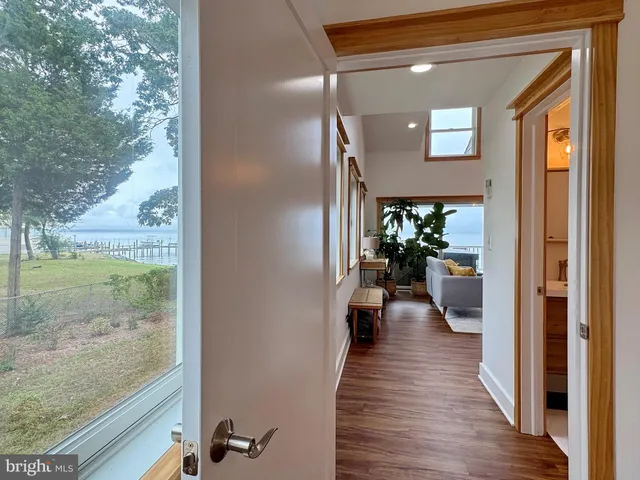 a living room with fireplace furniture and a flat screen tv