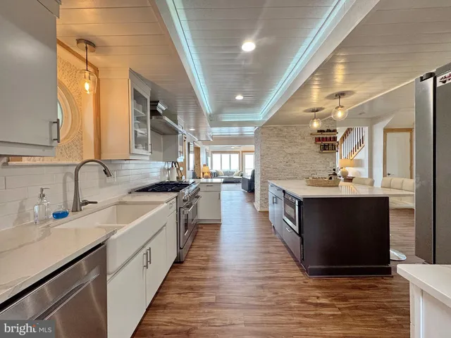 a spacious bedroom with a bed and a flat screen tv