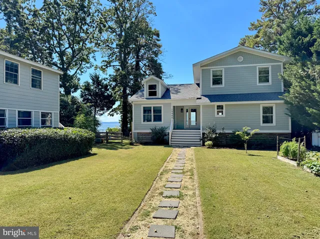 a view of a work space with furniture window and wooden floor