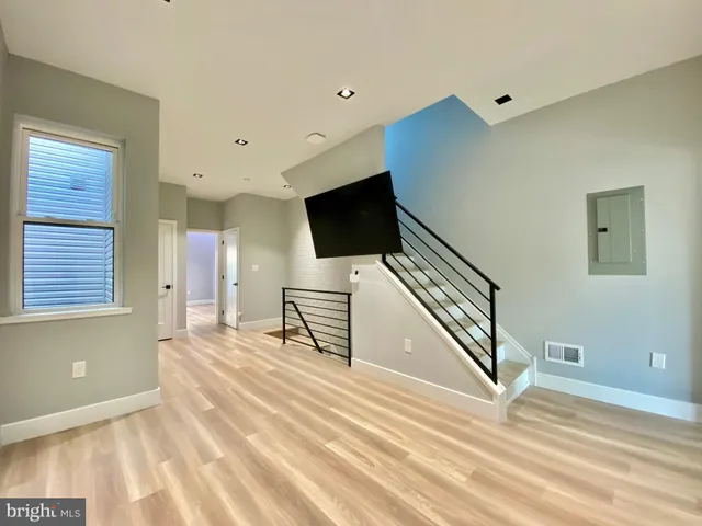 a brick building with a bench in front of it