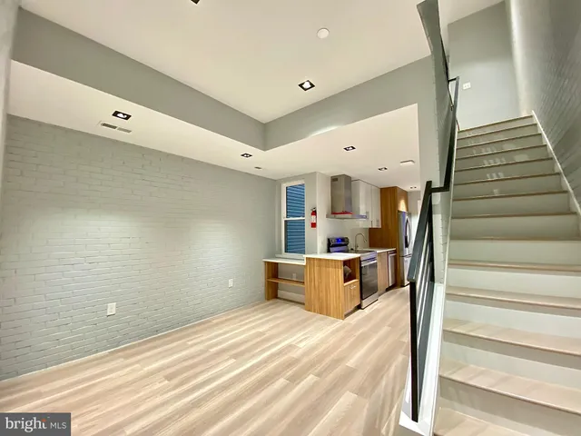 a view of a hallway with seating space