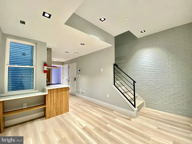 a kitchen with a sink stainless steel appliances and cabinets