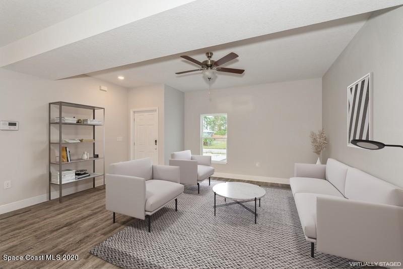 3231 Telesca Road Southeast Palm Bay, FL 32909 - Photo 3 of 17 02_1462LeewardAvenue_1_LivingRoom_FlexML