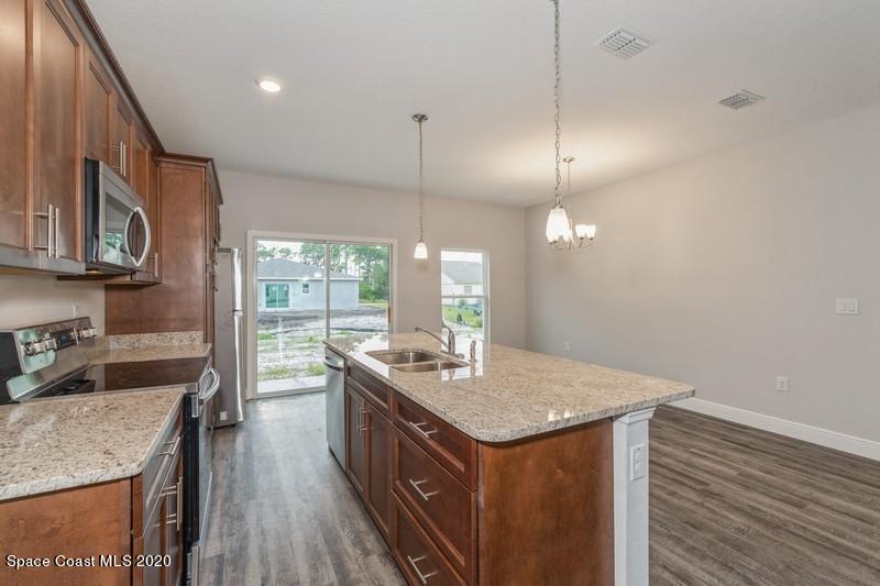 3231 Telesca Road Southeast Palm Bay, FL 32909 - Photo 5 of 17 04_1462LeewardAvenue_5_Kitchen_FlexMLS80