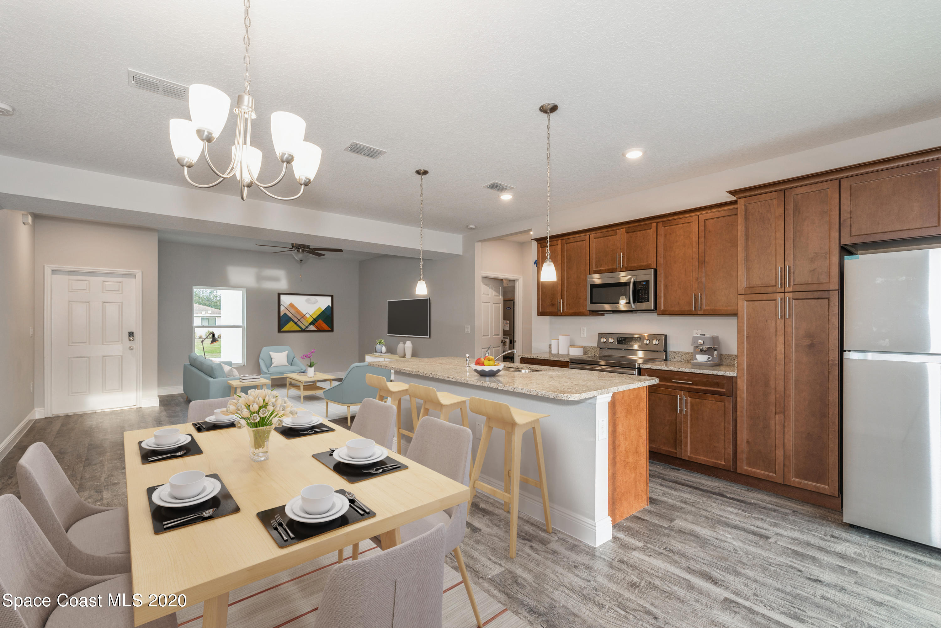 3231 Telesca Road Southeast Palm Bay, FL 32909 - Photo 7 of 17 05_1462LeewardAvenue_92_KitchenDiningRoo
