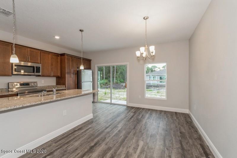 3231 Telesca Road Southeast Palm Bay, FL 32909 - Photo 9 of 17 07_1462LeewardAvenue_2_DiningRoom_FlexML