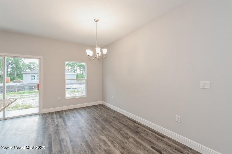 3231 Telesca Road Southeast Palm Bay, FL 32909 - Photo 10 of 17 08_1462LeewardAvenue_369001_DiningRoom_F