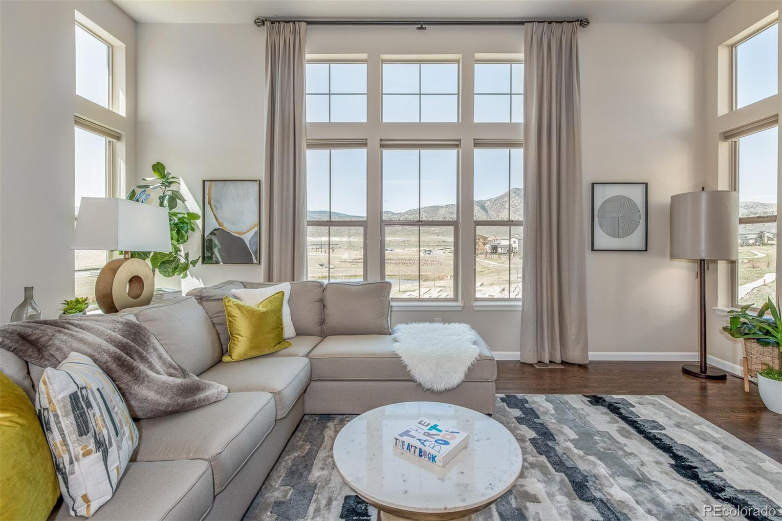 2589 South Kilmer Street Lakewood, CO 80228 - Photo 15 of 40 a living room with furniture and a large window