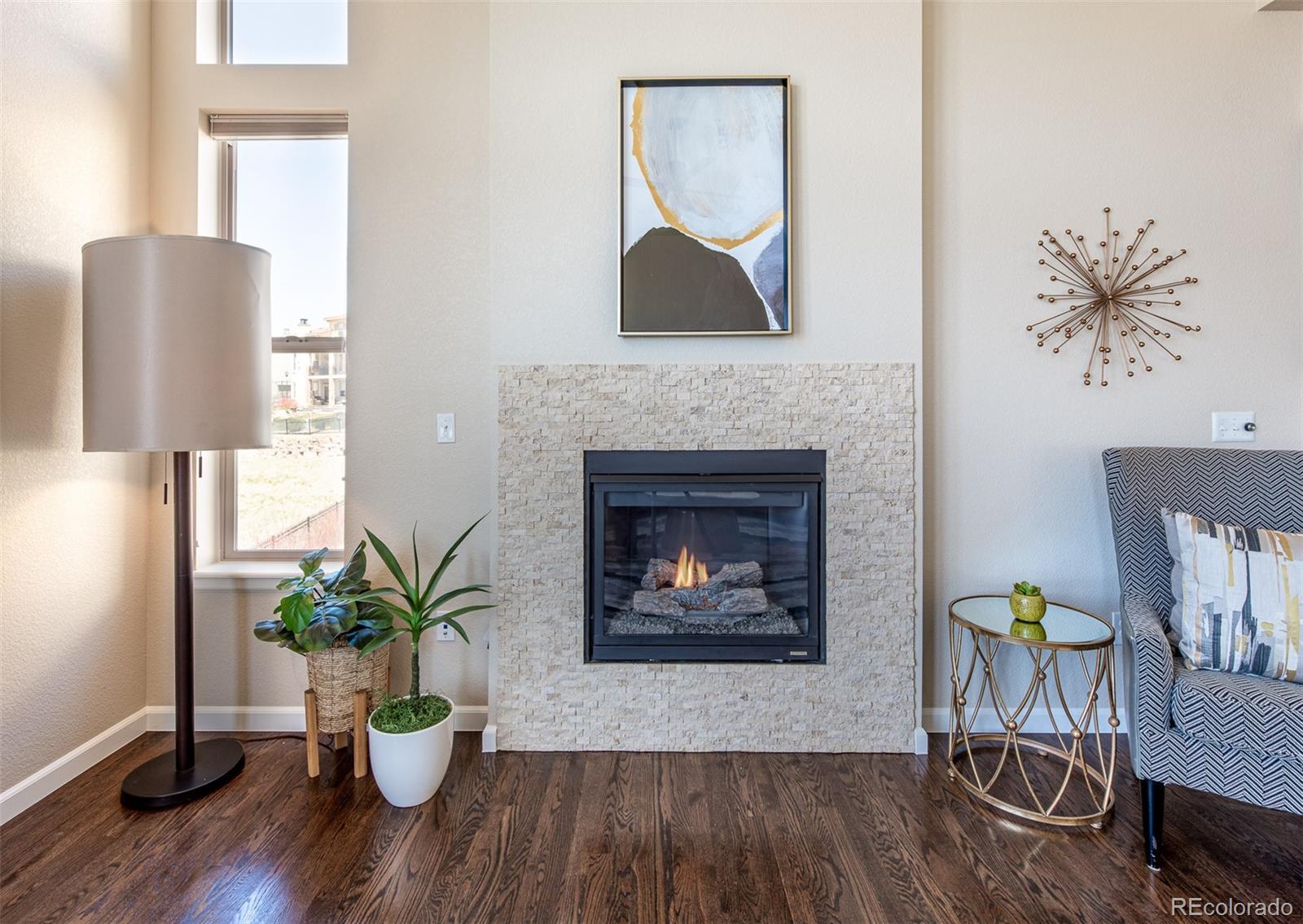 2589 South Kilmer Street Lakewood, CO 80228 - Photo 20 of 40 a living room with furniture and a fireplace