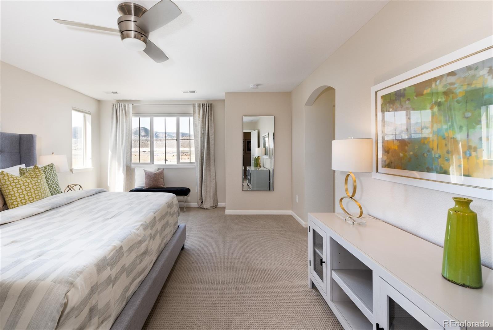2589 South Kilmer Street Lakewood, CO 80228 - Photo 21 of 40 a spacious bedroom with a bed and window