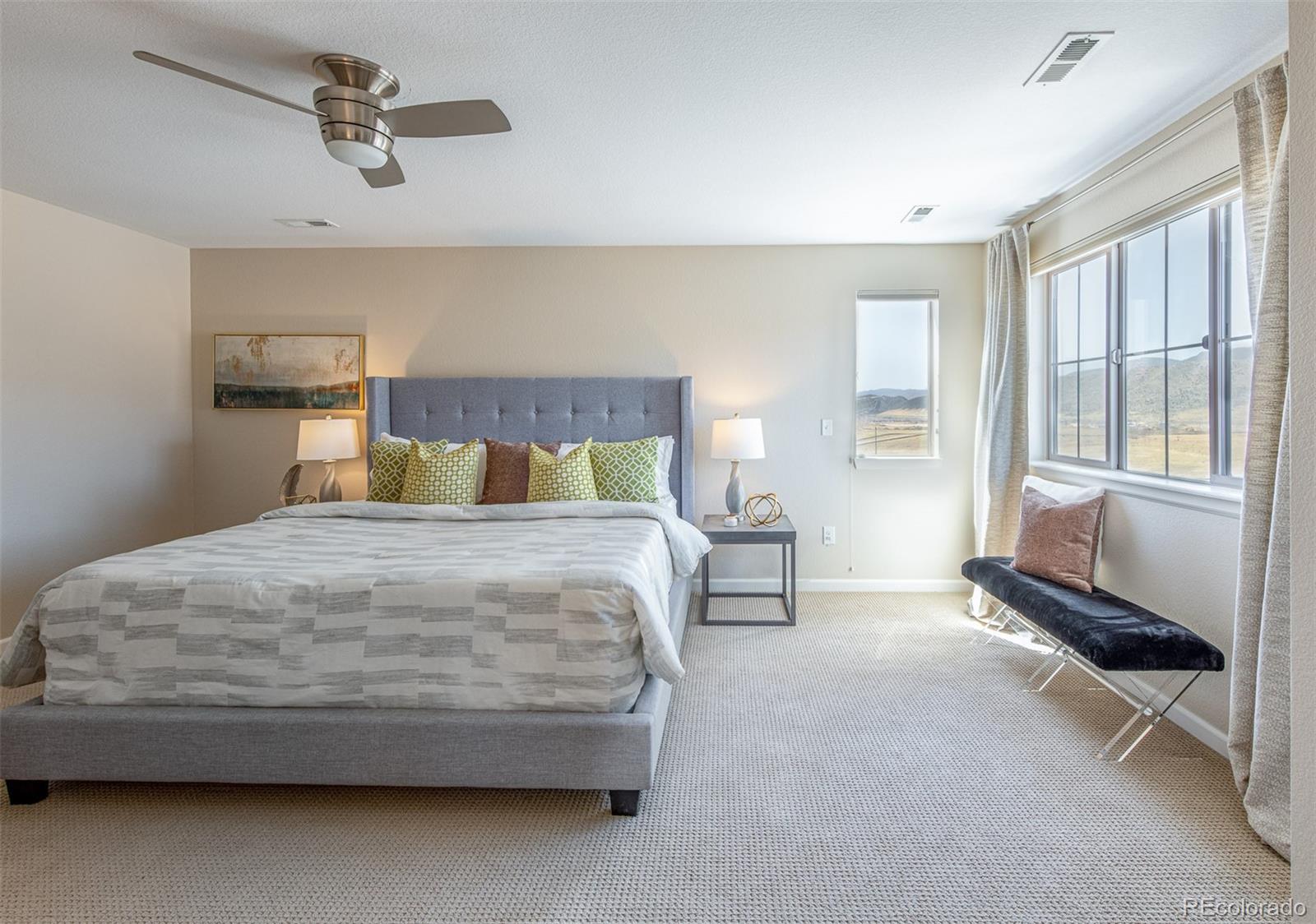 2589 South Kilmer Street Lakewood, CO 80228 - Photo 23 of 40 a bedroom with a bed and wooden floor