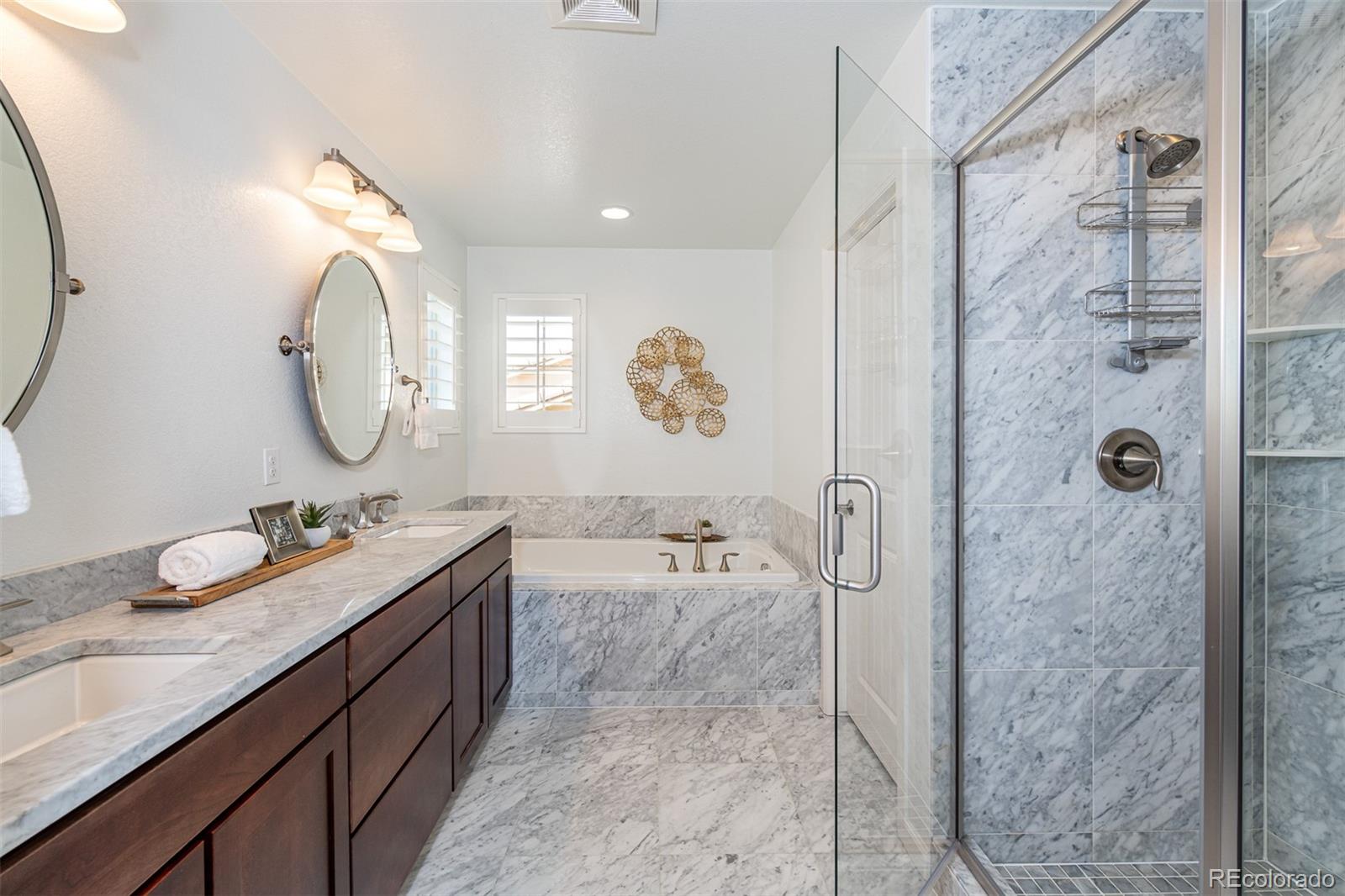 2589 South Kilmer Street Lakewood, CO 80228 - Photo 24 of 40 a spacious bathroom with a double vanity sink mirror and shower