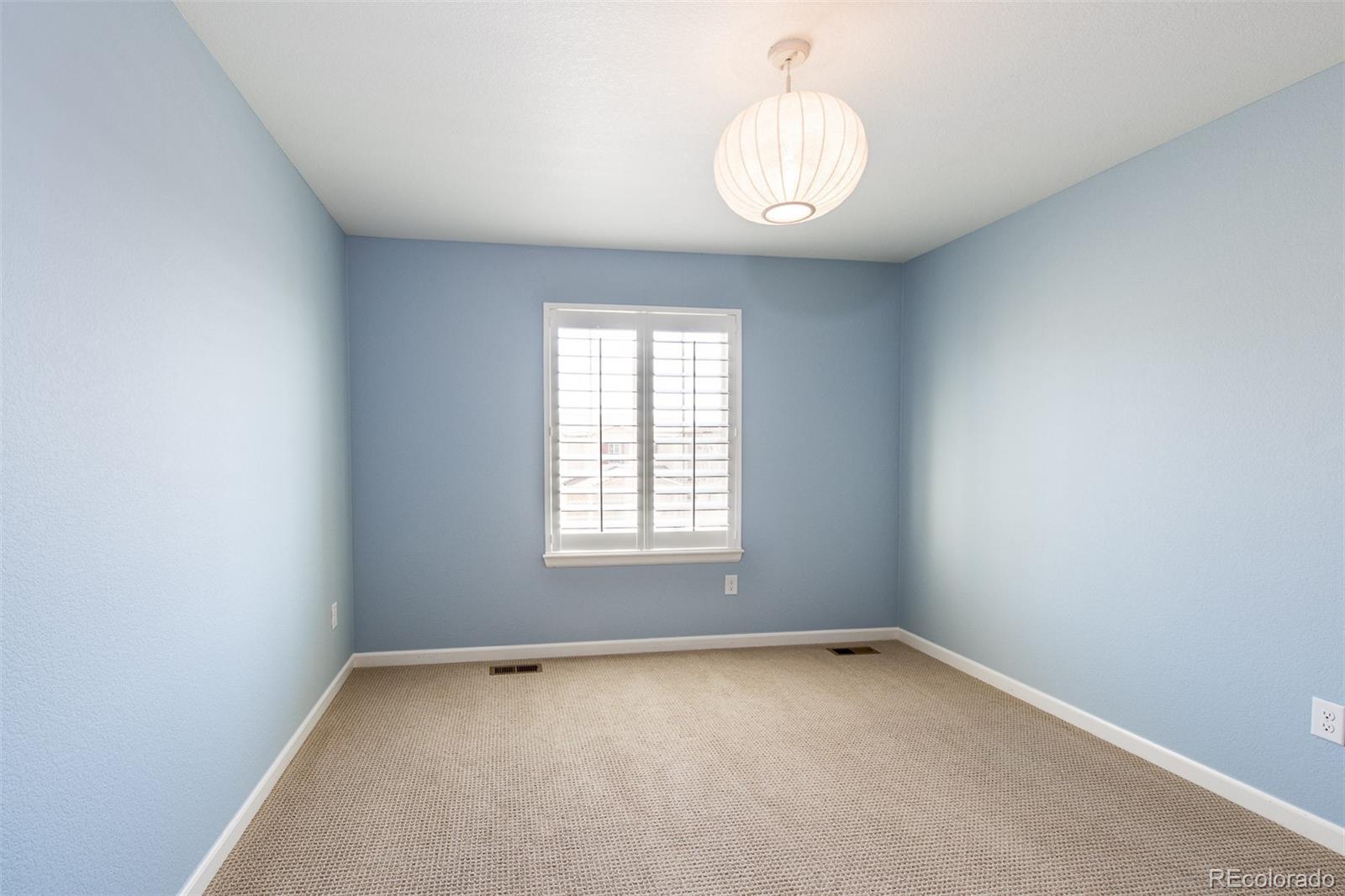 2589 South Kilmer Street Lakewood, CO 80228 - Photo 25 of 40 an empty room with a window