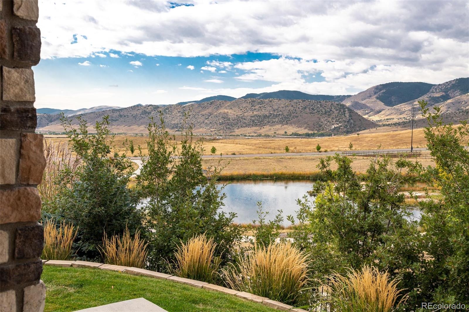 2589 South Kilmer Street Lakewood, CO 80228 - Photo 37 of 40 a view of a lake with a mountain in the background