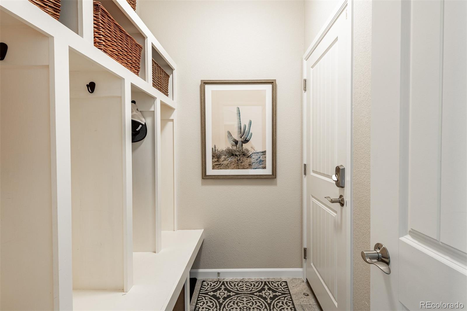 2589 South Kilmer Street Lakewood, CO 80228 - Photo 5 of 40 a bathroom with a shower and a sink