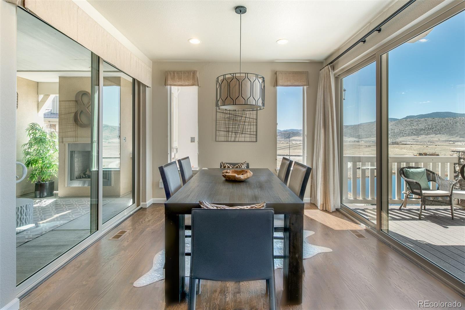 2589 South Kilmer Street Lakewood, CO 80228 - Photo 8 of 40 a view of a a dining room with furniture window and outside view