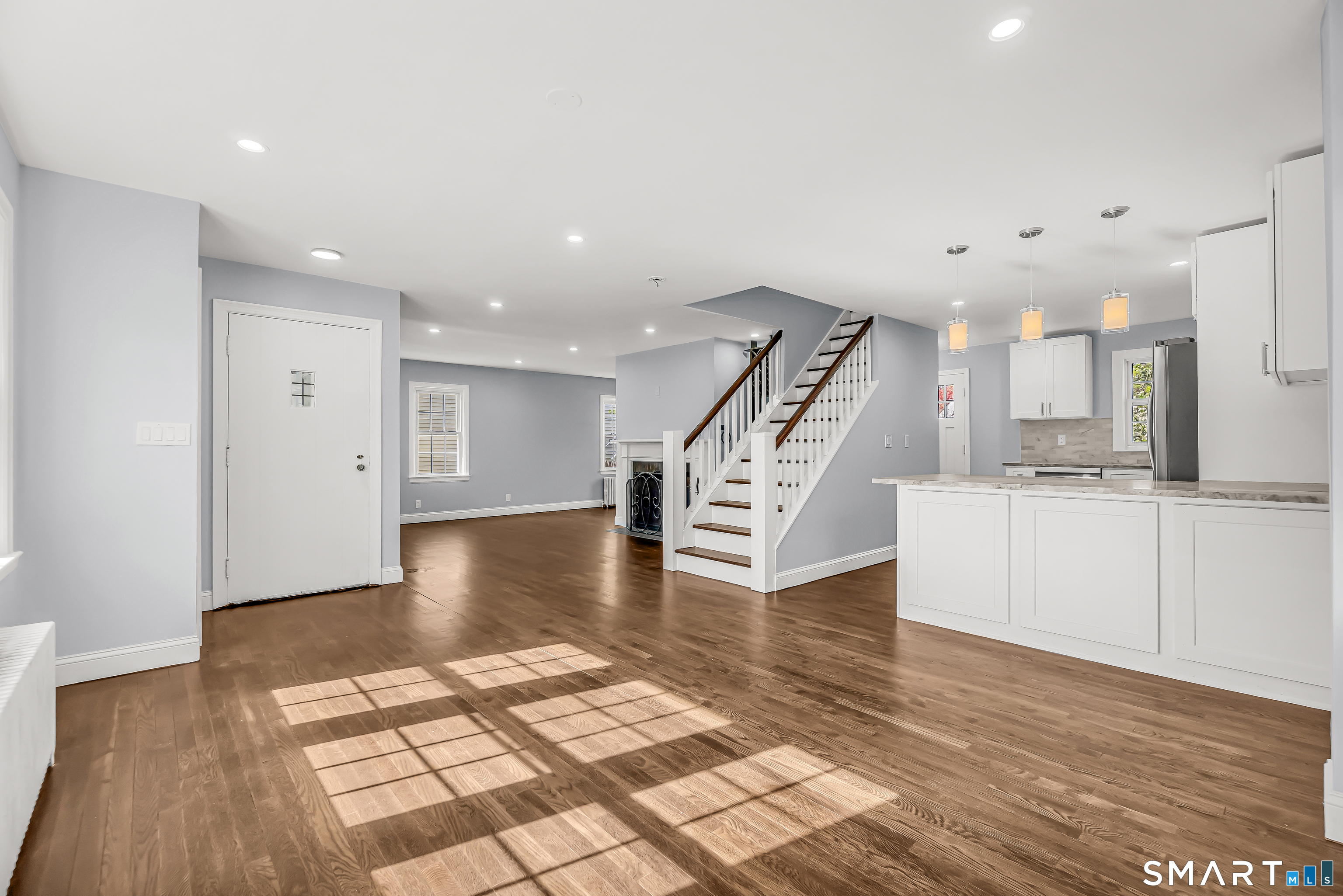 1770 Stratfield Road Fairfield, CT 06825 - Photo 13 of 40 a view of kitchen and hall with wooden floor