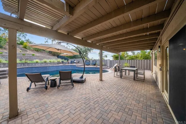 a view of a backyard with brick wall