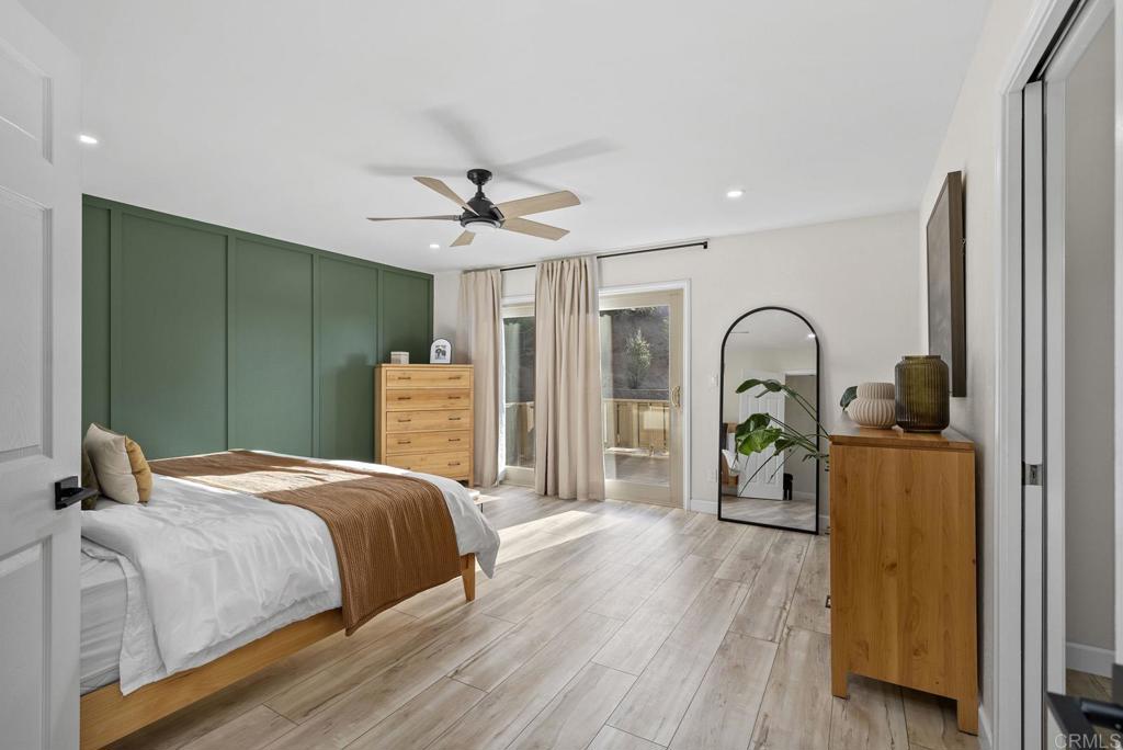 4120 Country Trails Lane Bonita, CA 91902 - Photo 25 of 26 a bedroom with a bed and a chandelier