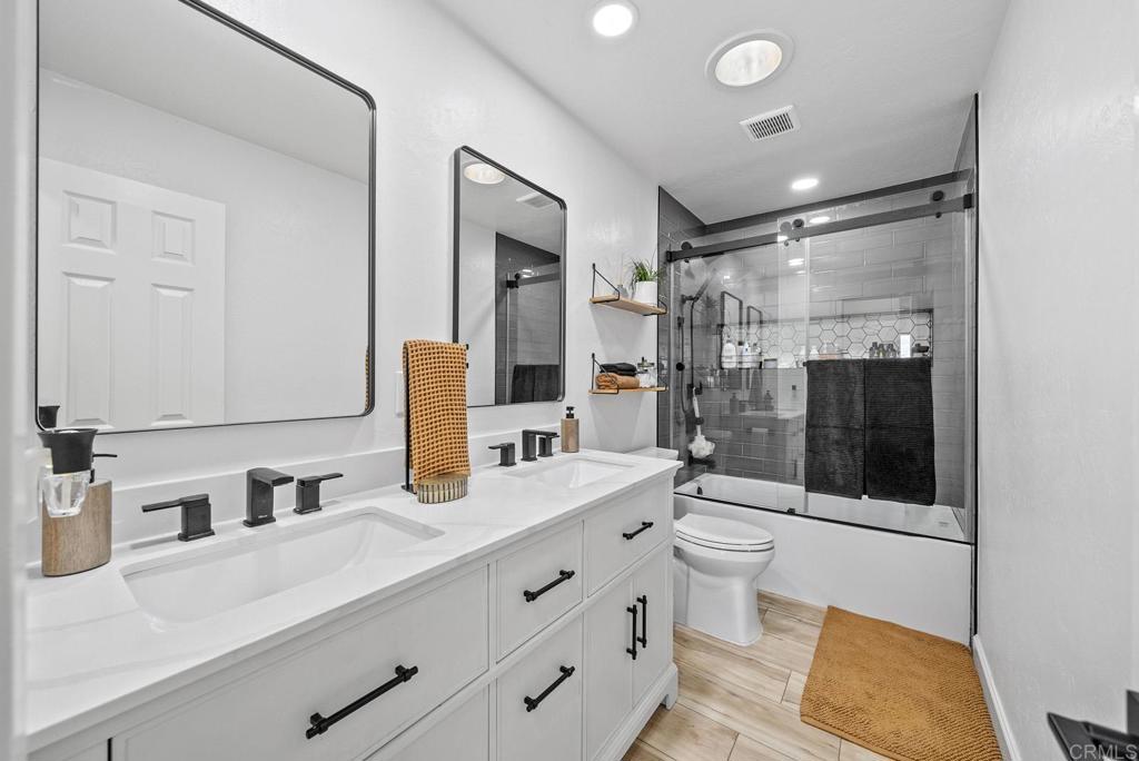 4120 Country Trails Lane Bonita, CA 91902 - Photo 5 of 26 a bathroom with a sink double vanity and a shower