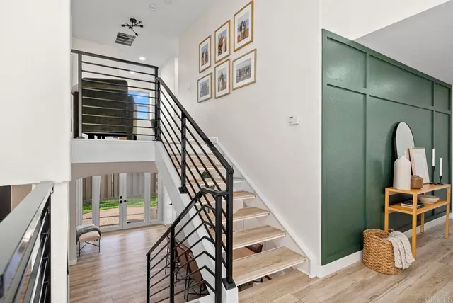 a room with furniture and a potted plant