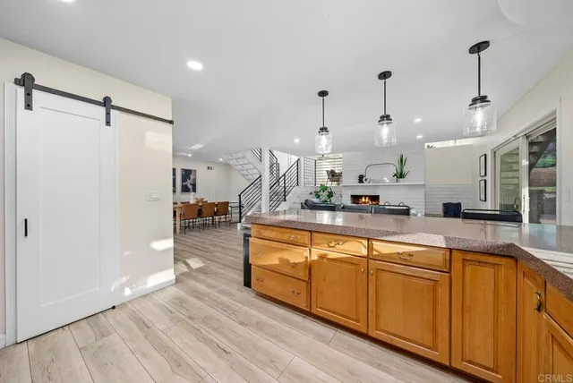 a view of a livingroom with furniture and a hardwood floor