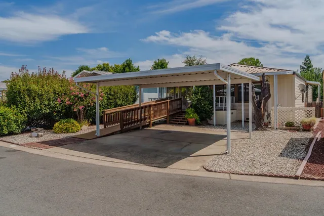 front view of a house with a garden